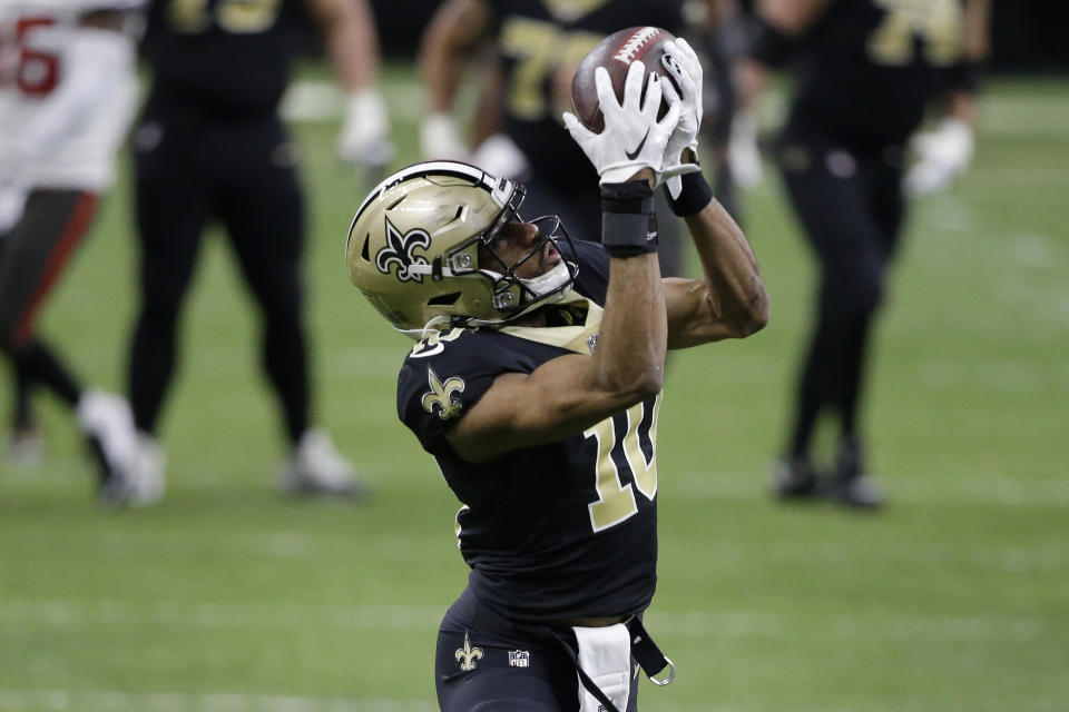 New Orleans Saints wide receiver Tre'Quan Smith (10) makes a touchdown catch against the Tampa Bay Buccaneers during the first half of an NFL divisional round playoff football game, Sunday, Jan. 17, 2021, in New Orleans. (AP Photo/Butch Dill)