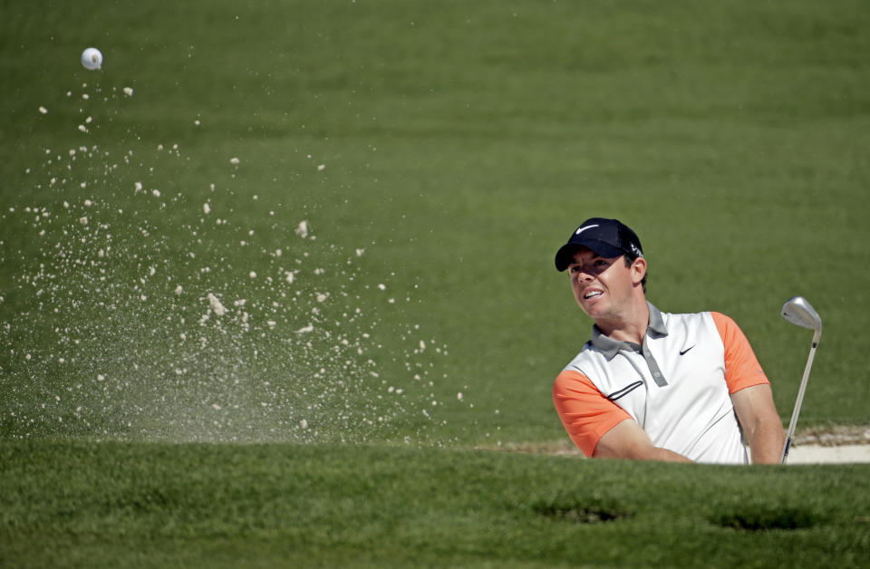 Rory McIlroy, of Northern Ireland, hits out of a bunker on the second green during the first round of the Masters golf tournament Thursday, April 10, 2014, in Augusta, Ga. (AP Photo/Chris Carlson)