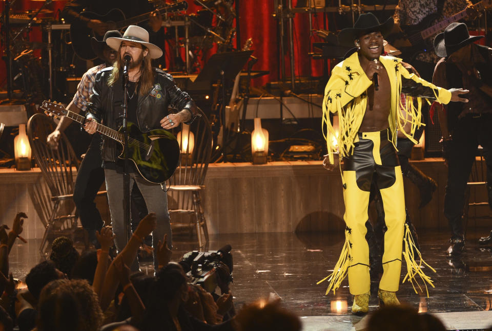 Billy Ray Cyrus, left, and Lil Nas X perform "Old Town Road" at the BET Awards on Sunday, June 23, 2019, at the Microsoft Theater in Los Angeles. (Photo by Chris Pizzello/Invision/AP)