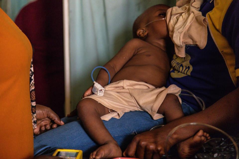 Nine-month-old Malik is breastfed by his mother Olamide (Yagazie Emnezi/Save The Children)