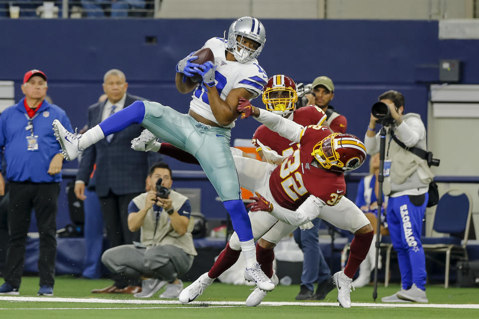 ARLINGTON, TX - DECEMBER 29: Dallas Cowboys wide receiver Amari Cooper (19) catches a pass for a first down over Washington Redskins cornerback Jimmy Moreland (32) during the game between the Dallas Cowboys and the Washington Redskins on December 29, 2019 at AT&T Stadium in Arlington, Texas.(Photo by Matthew Pearce/Icon Sportswire via Getty Images)