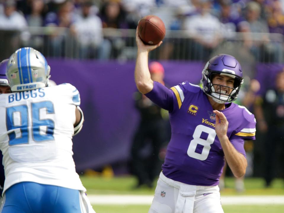 Kirk Cousins makes a throw against the Detroit Lions.