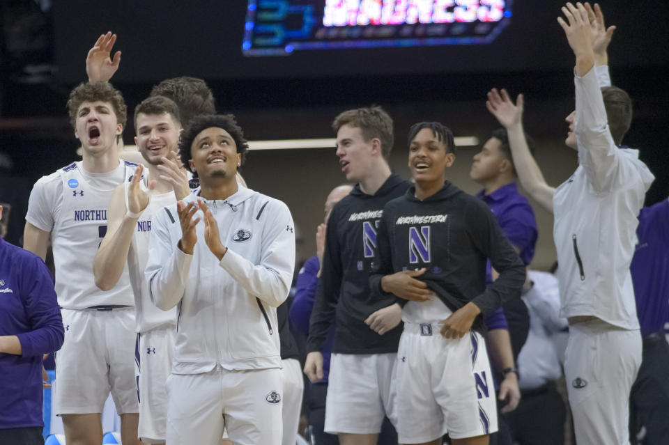 Northwestern players celebrate their win following a first-round college basketball game against Boise State in the NCAA Tournament in Sacramento, Calif., Thursday, March 16, 2023. Northwestern won 75-67. (AP Photo/Randall Benton)