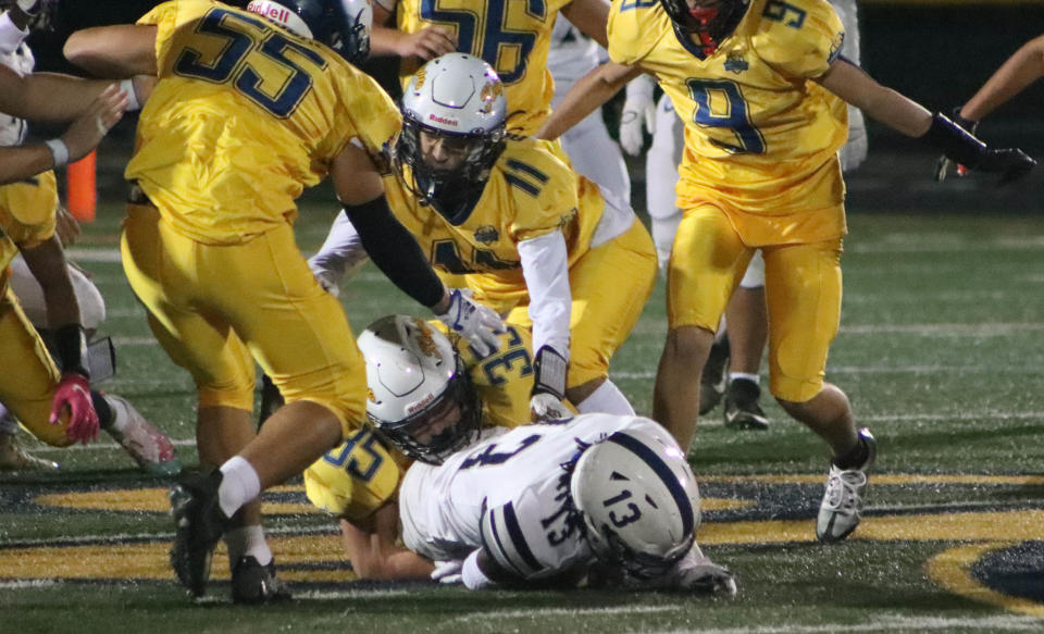 Eastern York's Johnathan Rose takes down West York's Nico Gasque during a YAIAA Division II football game at Eastern York High School on Friday, September 30, 2022.