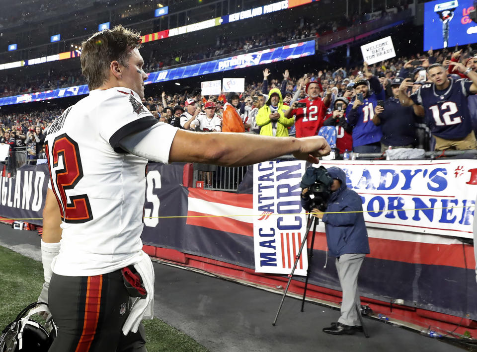 Foxborough, MA - October 3: Fans cheer Bucs quarterback  Tom Brady (12) as he leaves the field following during pre game warmups. The New England Patriots host the Tampa Bay Buccaneers in a regular season NFL game at Gillette Stadium in Foxborough, MA on Sunday, Oct. 3, 2021. (Photo by Jim Davis/The Boston Globe via Getty Images)