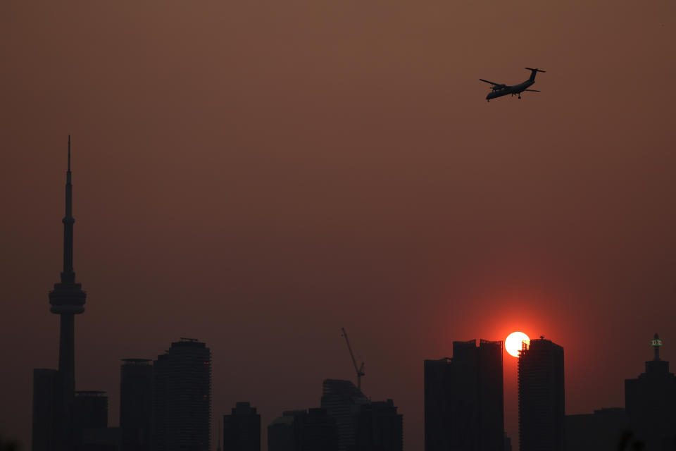 TORONTO, ON - JUNE 6  -   Smoke from forest fires in Northern Ontario and in Quebec contribute to pink hazy sunset in the city from the Cherry Beach  over Toronto. June 6, 2023.        (Steve Russell/Toronto Star via Getty Images)