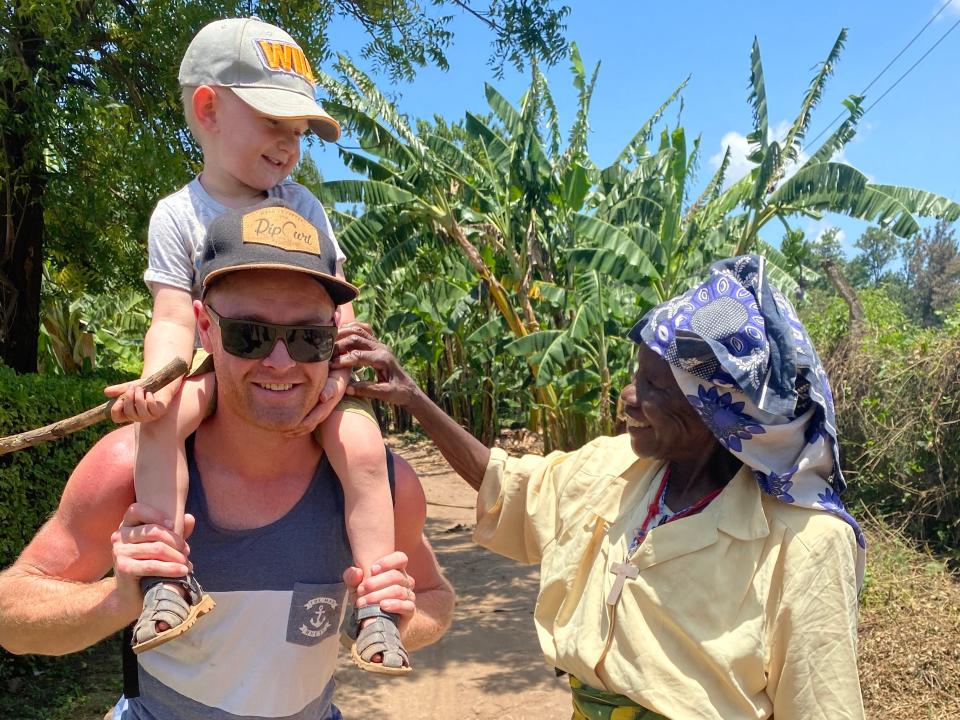 Edwards' husband and son with local woman.