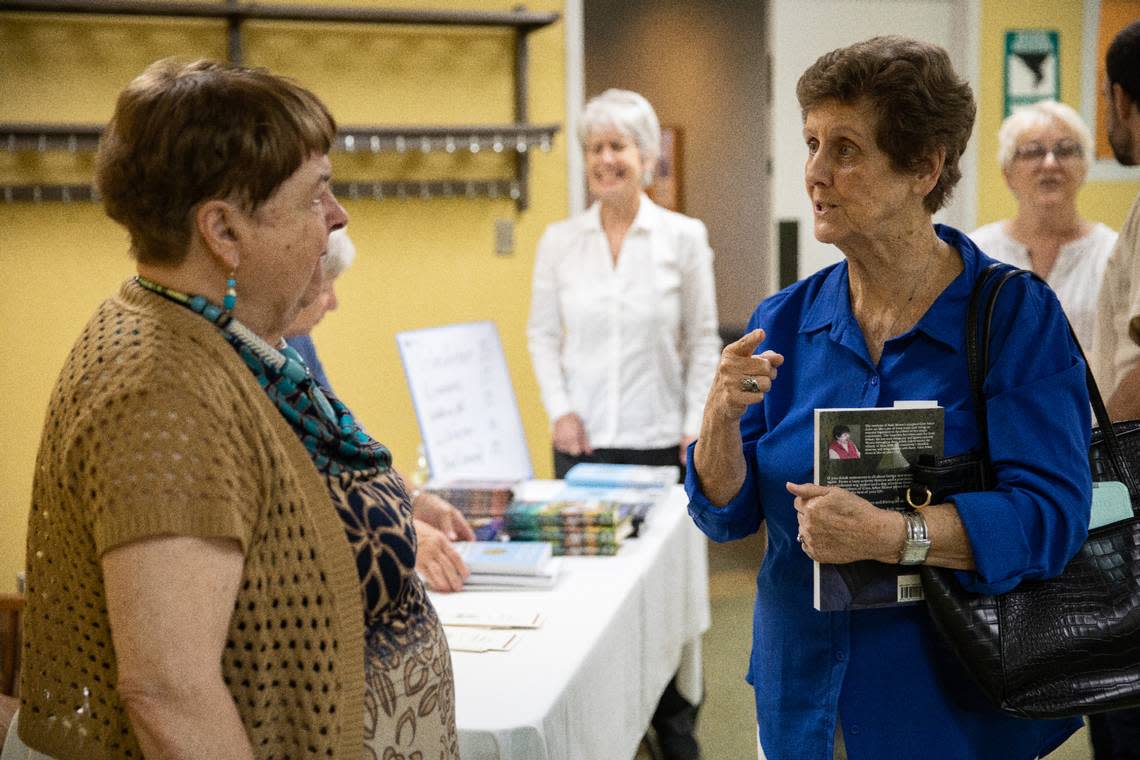 Nona Ehrenberg, of Stanly County, speaks to Ruth Moose after Moose’s speaking engagement at the Stanly County Public Library on September 10, 2022. Ehrenberg knows Moose from the local community.