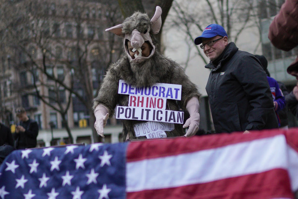 Supporters of former President Donald Trump's protest in front of the New York Criminal Courts building on Monday, March 20, 2023, in New York. A New York grand jury has heard from what could be the final witness in the investigation into Trump as law enforcement officials accelerate security preparations in advance of a possible indictment. (AP Photo/Eduardo Munoz Alvarez)