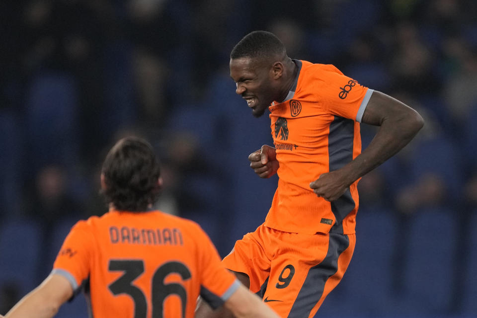 Inter Milan's Marcus Thuram celebrates after scoring his side's second goal during a Serie A soccer match between Lazio and Inter Milan, at Rome's Olympic Stadium, Sunday, Dec. 17, 2023. (AP Photo/Andrew Medichini)