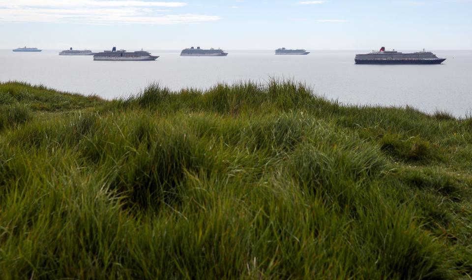 (left to right), the Cunard Cruise Liner Queen Mary 2 alongside P&O cruise ships Aurora, Arcadia, Britannia and Azura and the Cunard cruise ship Queen Victoria, at berth in Weymouth Bay, following the introduction of measures to bring the country out of lockdown. (Photo by Andrew Matthews/PA Images via Getty Images)