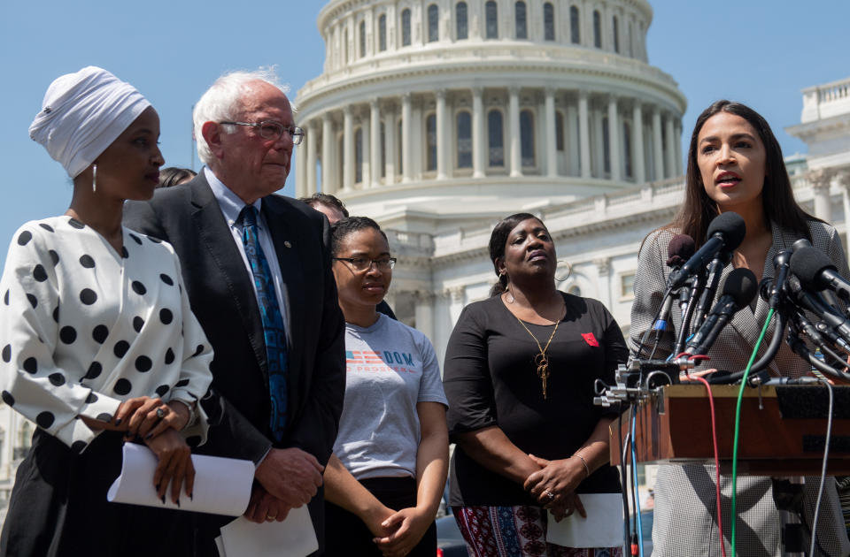 Representative Alexandria Ocasio-Cortez (2nd R), Democrat of New York, speaks alongside US Senator Bernie Sanders (2nd L), Independent of Vermont, and Representative Ilhan Omar (L), Democrat of Minnesota, during a press conference to introduce college affordability legislation outside the US Capitol in Washington, DC, June 24, 2019. (Photo by SAUL LOEB / AFP)        (Photo credit should read SAUL LOEB/AFP via Getty Images)