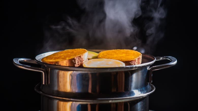 sweet potatoes steaming in pot