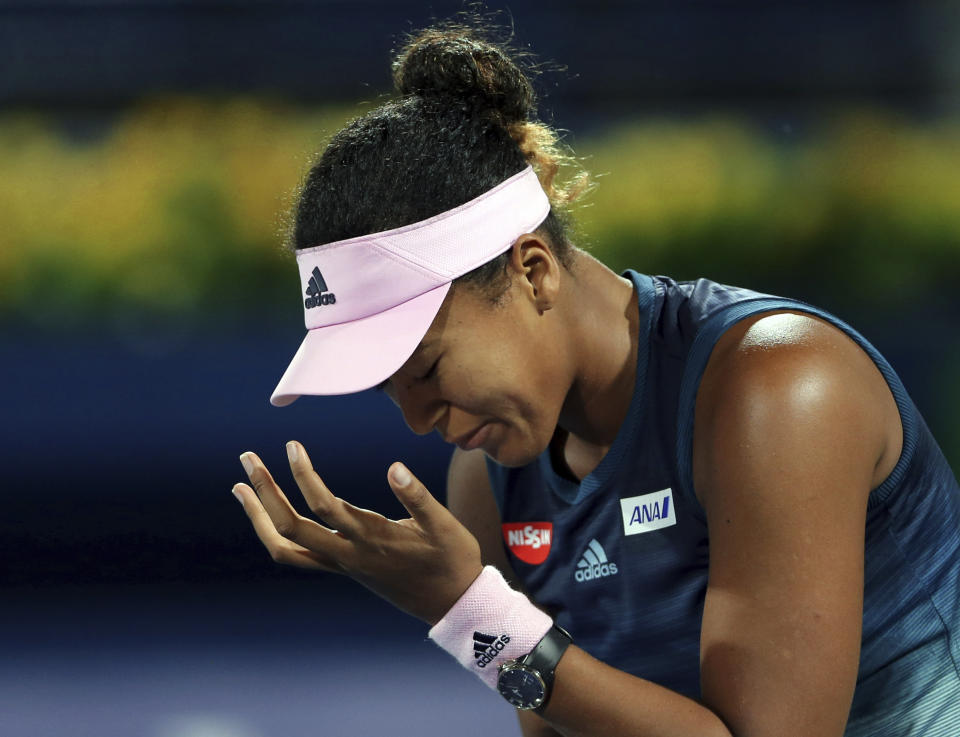 Naomi Osaka, of Japan, reacts during her match against Kristina Mladenovic, of France, at the Dubai Duty Free Tennis Championship in Dubai, United Arab Emirates, Tuesday, Feb. 19, 2019. (AP Photo/Kamran Jebreili)