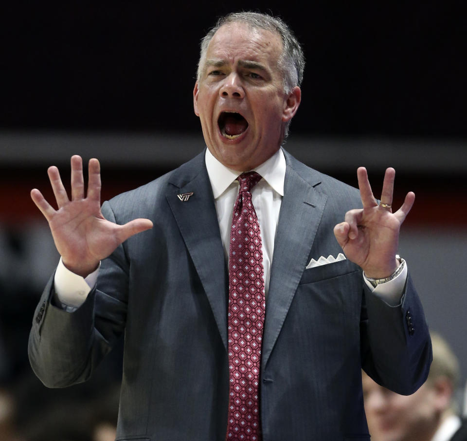 Virginia Tech coach Mike Young gestures during the first half of the team's NCAA college basketball game against Virginia on Wednesday, Feb. 26, 2020, in Blacksburg, Va. (Matt Gentry/The Roanoke Times via AP)