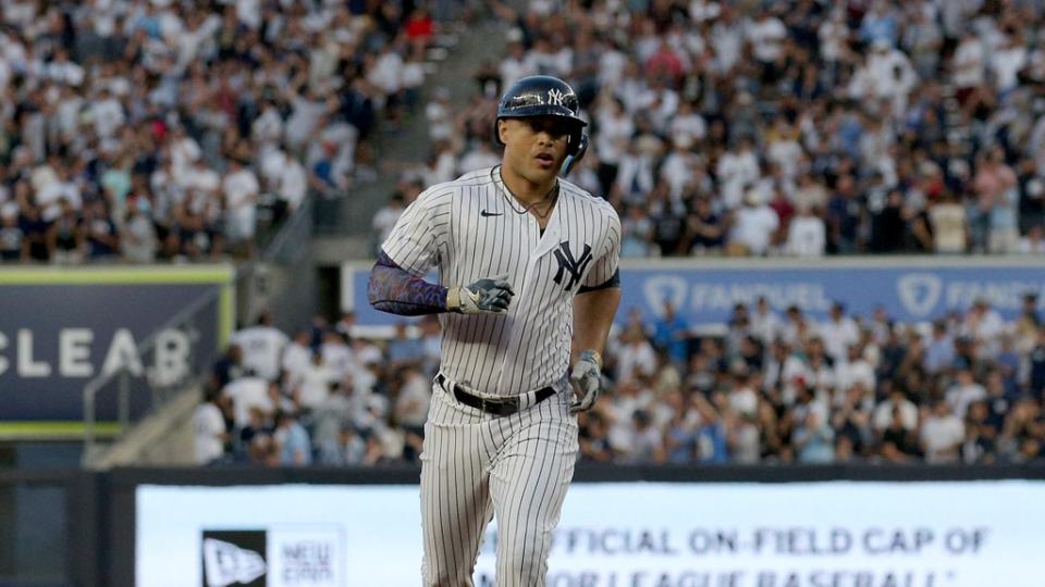 Aug 2, 2023; Bronx, New York, USA; New York Yankees right fielder Giancarlo Stanton (27) rounds the bases after hitting a three run home run against the Tampa Bay Rays during the third inning at Yankee Stadium. Mandatory Credit: Brad Penner-USA TODAY Sports