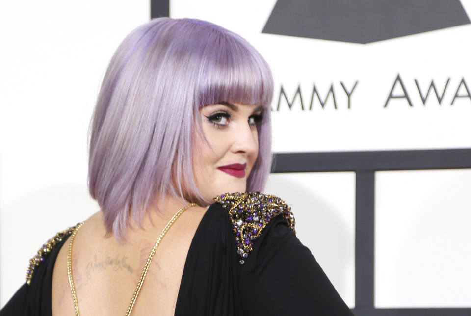 Television personality Kelly Osbourne arrives at the 56th annual Grammy Awards in Los Angeles, California January 26, 2014. REUTERS/Danny Moloshok (UNITED STATES TAGS: ENTERTAINMENT) (GRAMMYS-ARRIVALS) 