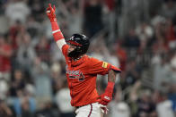 Atlanta Braves shortstop Orlando Arcia (11) celebrates his solo homer against the Cleveland Guardians during the eighth inning of a baseball game, Friday, April 26, 2024, in Atlanta. (AP Photo/Mike Stewart)