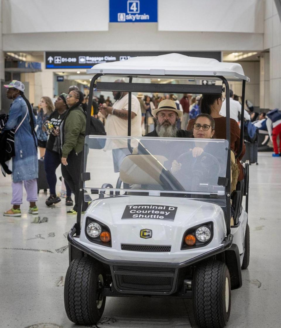 A courtesy shuttle makes its way along Concourse D at Miami International Airport, Wednesday, Sept. 27, 2023. The elevated SkyTrain servicing Concourse Da has been down since Sept. 15, 2023, and is now expected to resume partial service in March 2024.