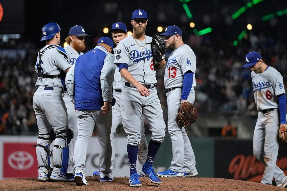 Los Angeles Dodgers relief pitcher Shane Greene (28) is removed by manager Dave Roberts during the fifth inning against the San Francisco Giants in a baseball game Friday, Sept. 3, 2021, in San Francisco. (AP Photo/Tony Avelar)