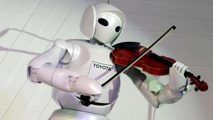 Ein Roboter als Musiker: Viele glauben, dass Künstliche Intelligenz die Gesellschaft spürbar verändern wird. Foto: dpa