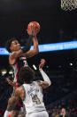 Georgia center Braelen Bridges shoot over Georgia Tech forward Javon Franklin during the first half of an NCAA college basketball game Tuesday, Dec. 6, 2022, in Atlanta. (AP Photo/Hakim Wright Sr.)