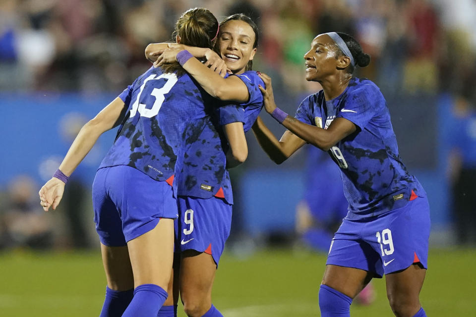 United States forward Alex Morgan (13) celebrates her goal with teammates Mallory Swanson (9) and Crystal Dunn (19) during the first half of a SheBelieves Cup soccer match against Brazil, Wednesday, Feb. 22, 2023, in Frisco, Texas. (AP Photo/LM Otero)