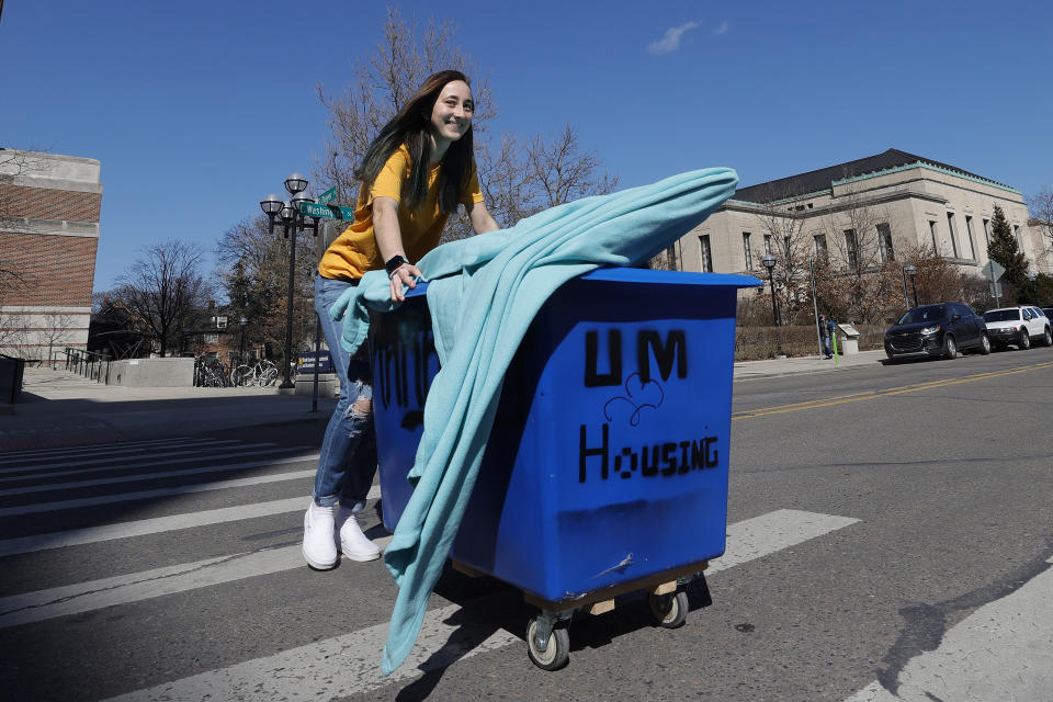 ANN ARBOR, MICHIGAN  - MARCH 17: Peyton Grant of Lavallette, New Jersey pack up and moves out of her dorm at the University of Michigan on March 17, 2020 in Ann Arbor, Michigan. College students across America are being told to leave campus and continue classes online after the World Health Organization (WHO) declared Coronavirus (COVID-19) a pandemic. (Photo by Gregory Shamus/Getty Images)