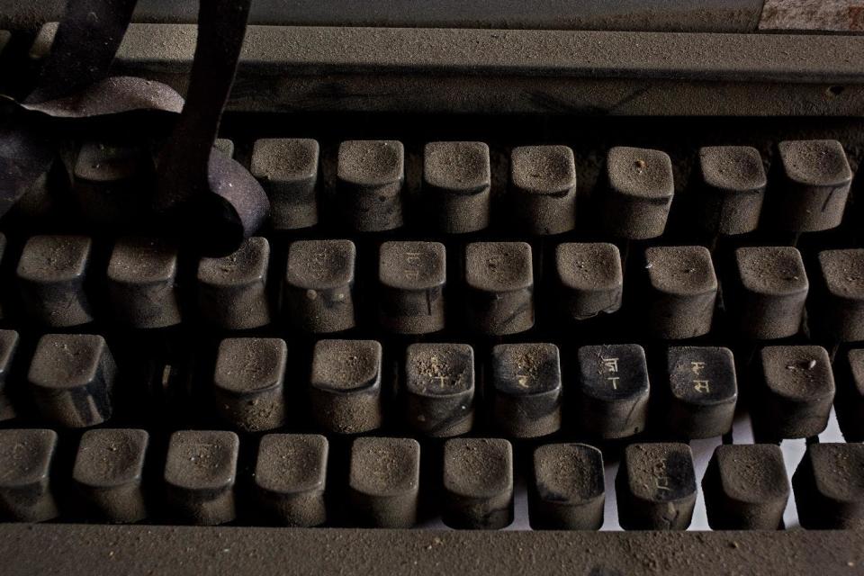 In this Jan. 16, 2017 photo, an old Remington 2000 typewriter lies covered in dust in New Delhi, India. In India, the typewriter was never just a piece of office equipment. It was a sign of education, of professional achievement, of women’s growing independence as they slowly entered the workforce. But in one of the last places in the world where it remains a part of everyday life, twilight is at hand. (AP Photo/Bernat Armangue)