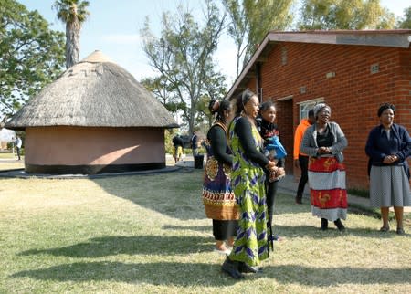 Mourners gather at former Zimbabwe President Robert Mugabe's rural homestead in Kutama village