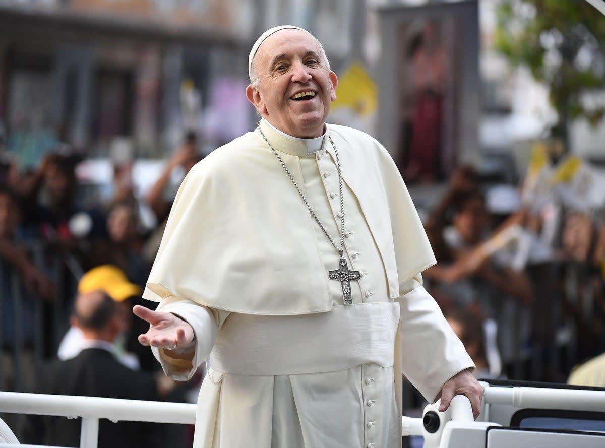 Pope Francis smiles at the faithful from the Popemobile in Santiago, on January 15, 2018 (EITAN ABRAMOVICH/AFP via Getty Images)