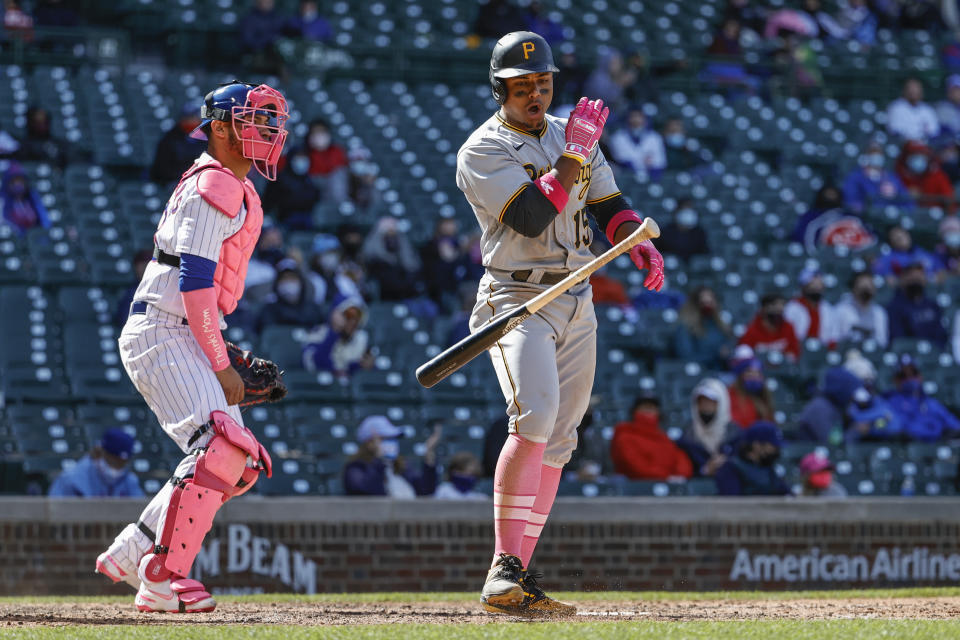 Pittsburgh Pirates' Wilmer Difo, right, reacts after striking out off Chicago Cubs relief pitcher Jason Adam (not shown) during the ninth inning of a baseball game, Sunday, May 9, 2021, in Chicago. (AP Photo/Kamil Krzaczynski)