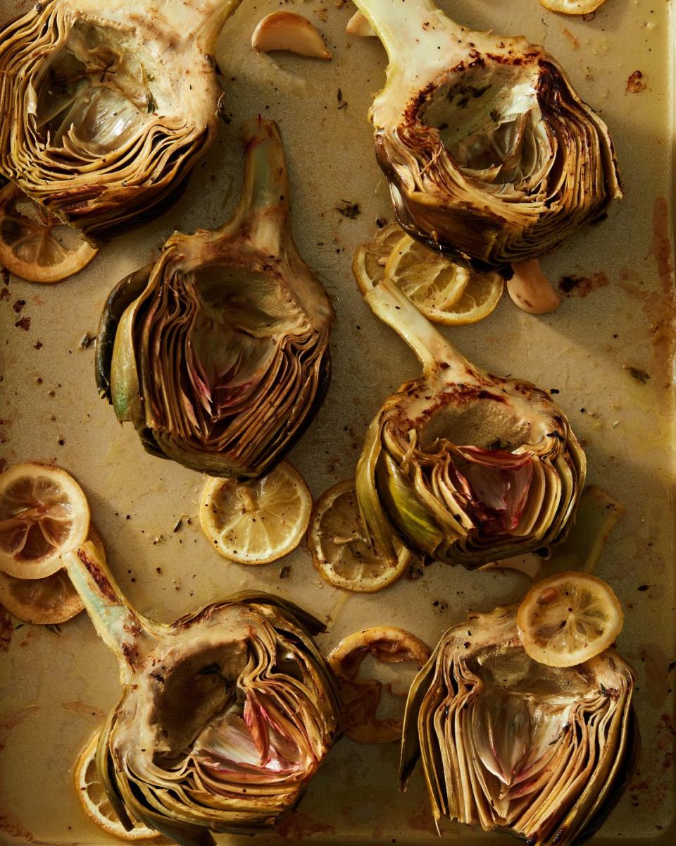 <p>After roasting, the exterior petals can be pulled off, and you can use your teeth to scrape out the delicious, tender insides. We think our simple recipe for Old Bay <a href="https://www.delish.com/cooking/recipe-ideas/a25363303/whole30-paleo-mayo-recipe/" rel="nofollow noopener" target="_blank" data-ylk="slk:mayo;elm:context_link;itc:0" class="link ">mayo</a> really complements the <a href="https://www.delish.com/cooking/g950/artichoke-recipes/" rel="nofollow noopener" target="_blank" data-ylk="slk:artichoke’s;elm:context_link;itc:0" class="link ">artichoke’s</a> lemon-herbal flavor profile, but feel free to swap in everything from <a href="https://www.delish.com/cooking/recipe-ideas/a37246615/tahini-sauce-recipe/" rel="nofollow noopener" target="_blank" data-ylk="slk:tahini sauce;elm:context_link;itc:0" class="link ">tahini sauce</a> to <a href="https://www.delish.com/cooking/recipe-ideas/a39978262/ketchup-recipe/" rel="nofollow noopener" target="_blank" data-ylk="slk:ketchup;elm:context_link;itc:0" class="link ">ketchup</a> if you prefer.</p><p>Get the <strong><a href="https://www.delish.com/cooking/recipe-ideas/a39039853/roasted-artichoke-recipe/" rel="nofollow noopener" target="_blank" data-ylk="slk:Roasted Artichokes recipe;elm:context_link;itc:0" class="link ">Roasted Artichokes recipe</a></strong>.</p>