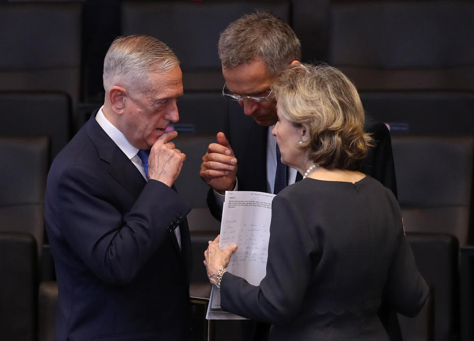 Defense Secretary James Mattis, left, speaks with NATO Secretary General Jens Stoltenberg and U.S. Permanent Representative to NATO Kay Bailey Hutchison before a session of NATO leaders and delegations from Ukraine and Georgia at the NATO summit on July 12, 2018, in Brussels. (Photo: Sean Gallup/Getty Images)