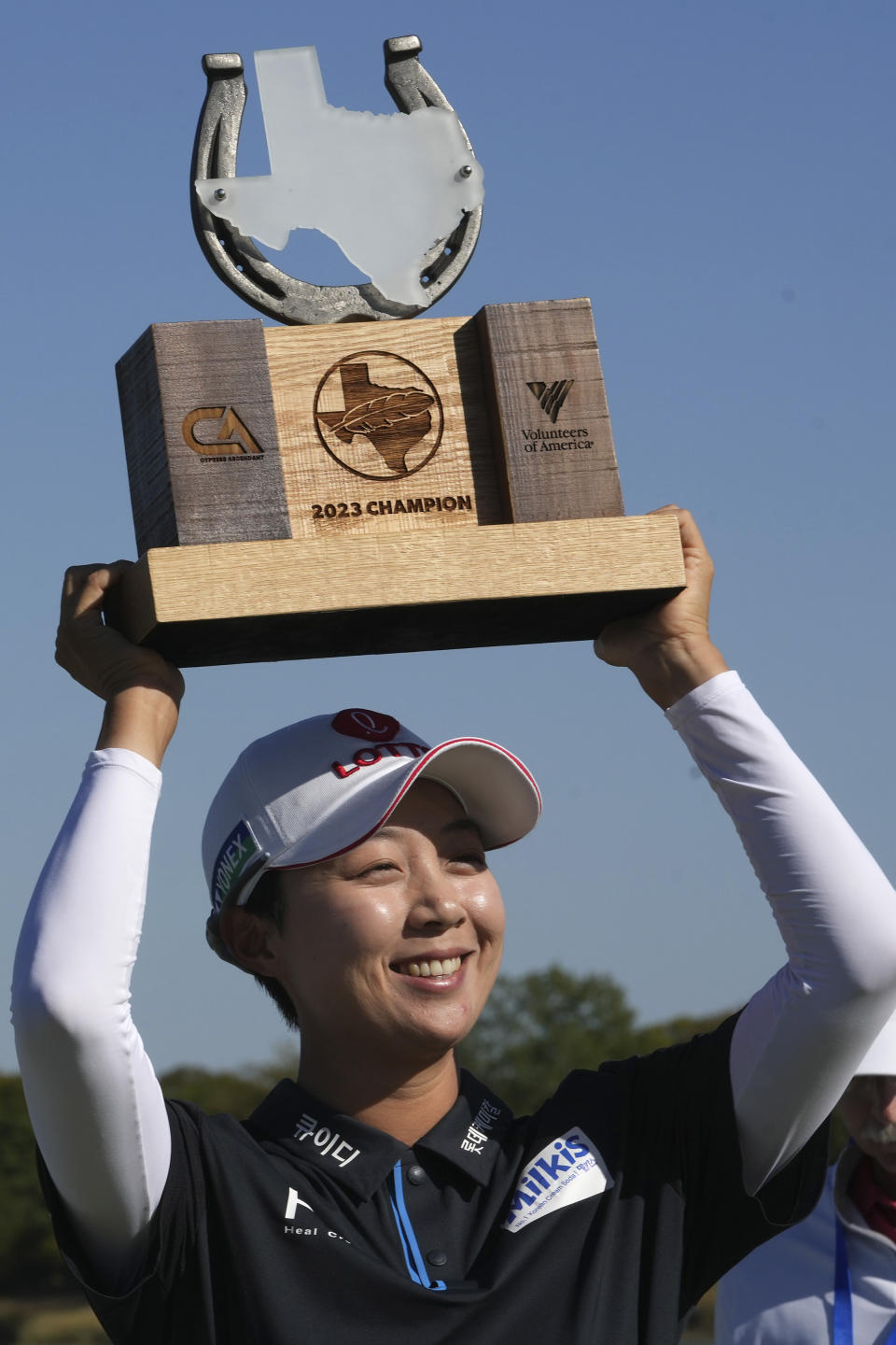 Kim Hyo-joo, of South Korea, lifts the trophy after winning the LPGA The Ascendant golf tournament in The Colony, Texas, Texas, Sunday, Oct. 8, 2023. (AP Photo/LM Otero)