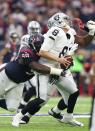 <p>Oakland Raiders quarterback Connor Cook (8) is sacked by Houston Texans nose tackle D.J. Reader (98) during the first quarter in the AFC Wild Card playoff football game at NRG Stadium. Mandatory Credit: Matthew Emmons-USA TODAY Sports </p>