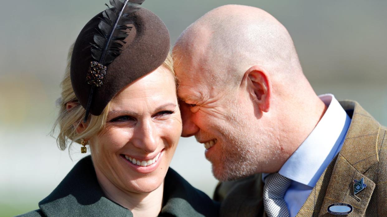 Zara Tindall smiling with Mike Tindall with his face rested on hers 