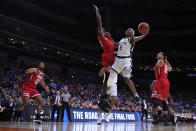 <p>Cassius Winston #5 of the Michigan State Spartans takes a shot against Koch Bar #12 of the Bradley Braves during their game in the First Round of the NCAA Basketball Tournament at Wells Fargo Arena on March 21, 2019 in Des Moines, Iowa. (Photo by Jamie Squire/Getty Images) </p>