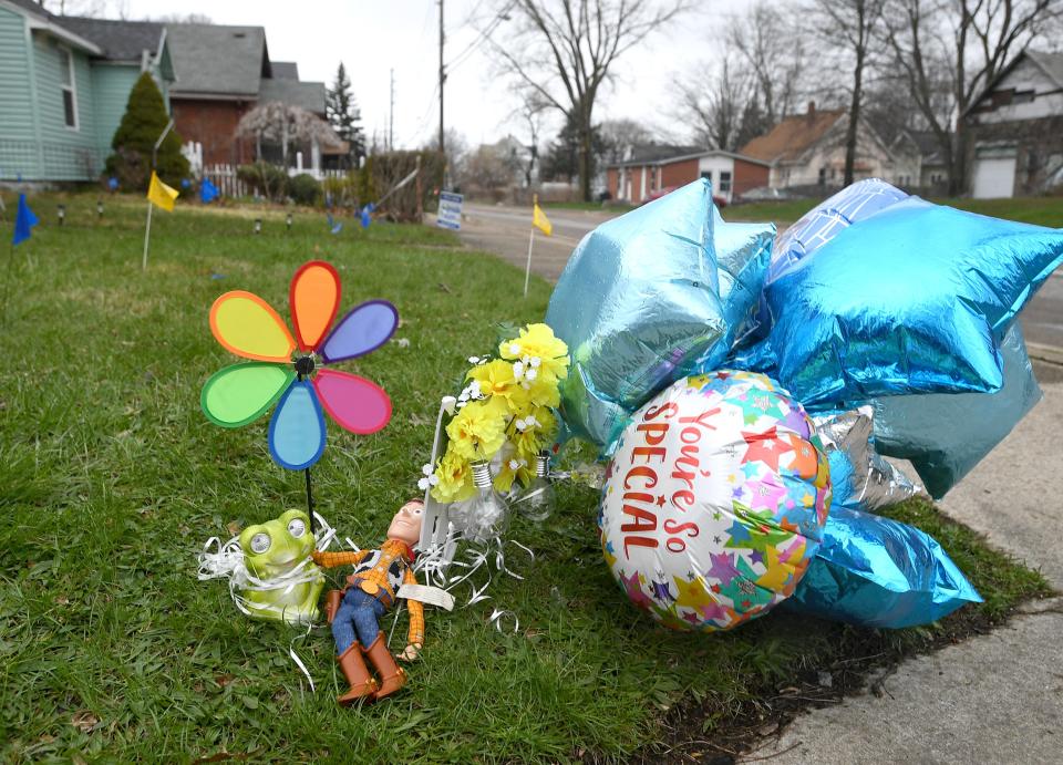 Balloons and toys are shown, on April 19, 2022, left in remembrance of Antonio "Espn" Yarger Jr., who was shot in the head on April 14, near this spot on the northwest corner of Fairmount Parkway and Downing Avenue in Erie. Yarger, 7, died on April 18.