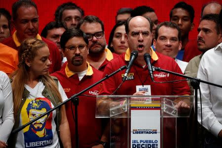 Julio Borges (C), president of the National Assembly and deputy of the Venezuelan coalition of opposition parties (MUD) addresses the media after an unofficial plebiscite against President Nicolas Maduro's government and his plan to rewrite the constitution, in Caracas, Venezuela July 16, 2017. REUTERS/Carlos Garcia Rawlins