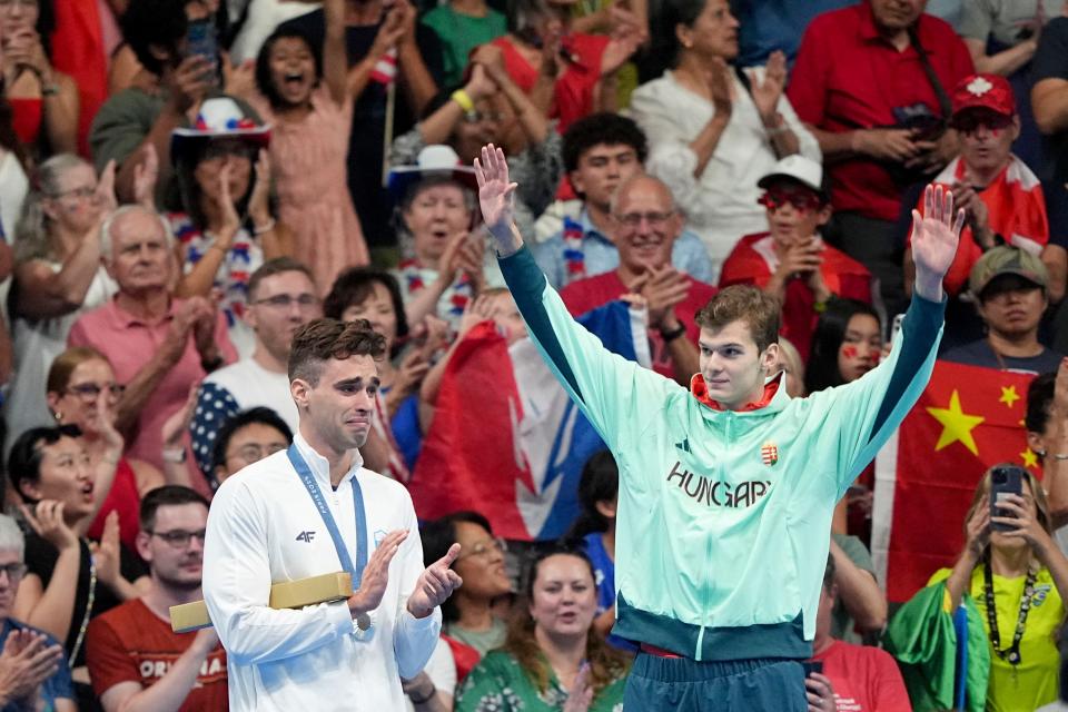 Hungary's Hubert Kos, right, celebrates after winning gold in the men’s 200-meter backstroke. Kos has transferred to Texas from Arizona State this summer and will compete for the Longhorns this upcoming season.