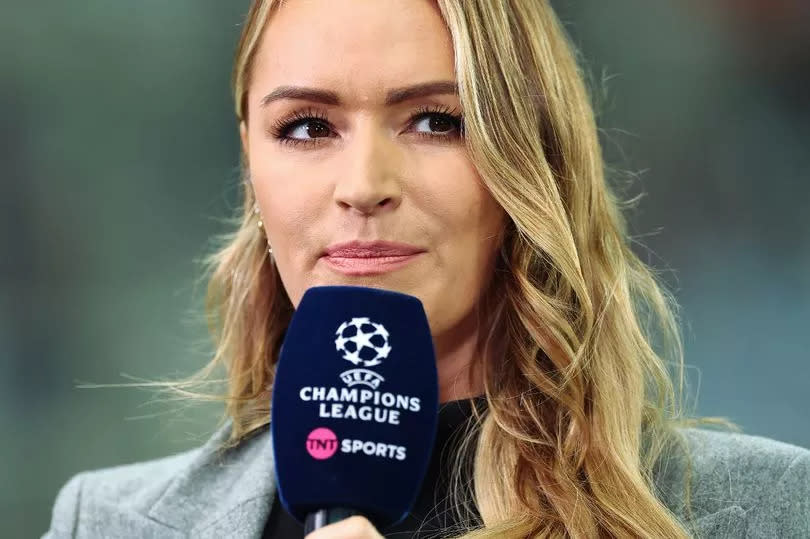 Laura Woods holding a microphone