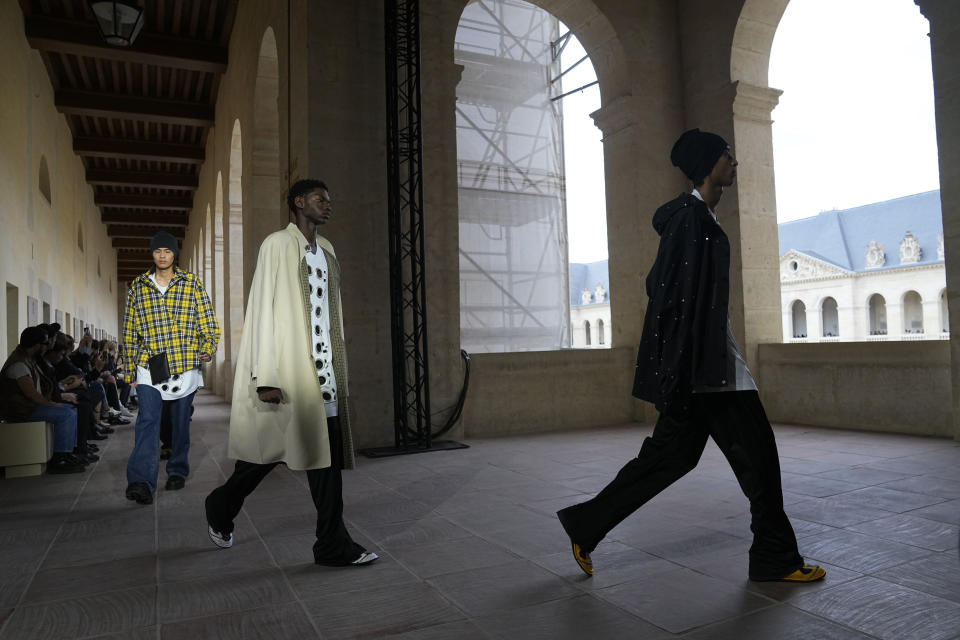 Models wear creations for Givenchy Menswear Spring/Summer 2024 fashion collection presented in Paris, Thursday, June 22, 2023. (AP Photo/Michel Euler)