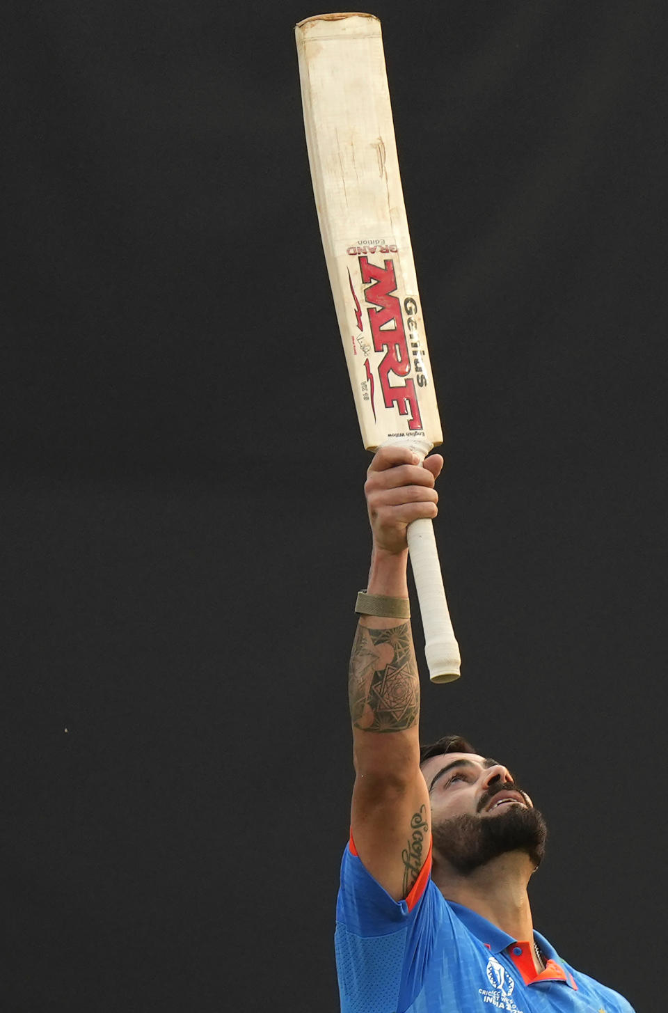 India's Virat Kohli celebrates his century during the ICC Men's Cricket World Cup first semifinal match between India and New Zealand in Mumbai, India, Wednesday, Nov. 15, 2023. (AP Photo/Rajanish Kakade)