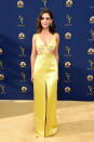 <p>Brie glowed in a golden-chartreuse cutout dress with jewel embellishments. (Photo: Getty Images) </p>