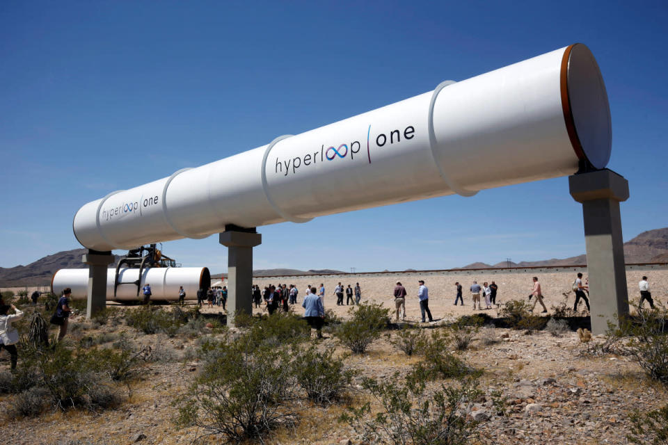 Journalists and guests look over tubes following a propulsion open-air test at Hyperloop One in North Las Vegas, Nev., on May 11, 2016. (Reuters/Steve Marcus)