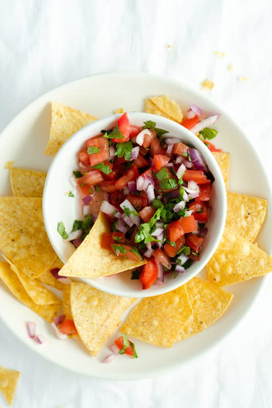<p>The Healthiful Ideas</p><p>Pico de Gallo is one of the easiest dips you can make along with guacamole. I like serving it with tortilla chips as a snack or an appetizer. </p><p><strong>Get the Recipe: </strong><a href="https://thehealthfulideas.com/pico-de-gallo/" rel="nofollow noopener" target="_blank" data-ylk="slk:Pico de Gallo;elm:context_link;itc:0;sec:content-canvas" class="link ">Pico de Gallo</a></p>