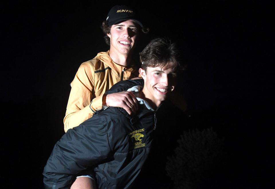 Lex Young, left, and Leo Young were a dominant duo on the course to help the Newbury Park cross country team finish the season as the top team in the country for the fourth straight year.
