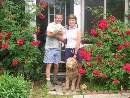 Mike Cook of Lansing, with his partner Simonetta and their dogs. Cook, a longtime Cornell employee, is searching for a living kidney donor.