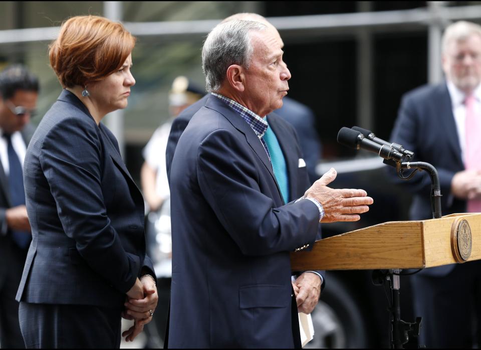 New York City Mayor Michael Bloomberg talks to the media near the Empire State Building following a shooting, Friday, Aug. 24, 2012, in New York. Bloomberg said some of the victims may have been hit by police bullets as police and the gunman exchanged fire. Police say a recently laid-off worker shot a former colleague to death near the iconic skyscraper and then randomly opened fired on people nearby before firing on police. (AP Photo/Julio Cortez)